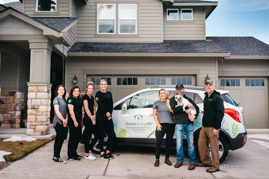 Staff of Cleaner Living posing for company photo outside home